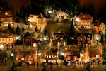 Kerstkaart: Verlichte huisjes vormen samen een kerstdorp